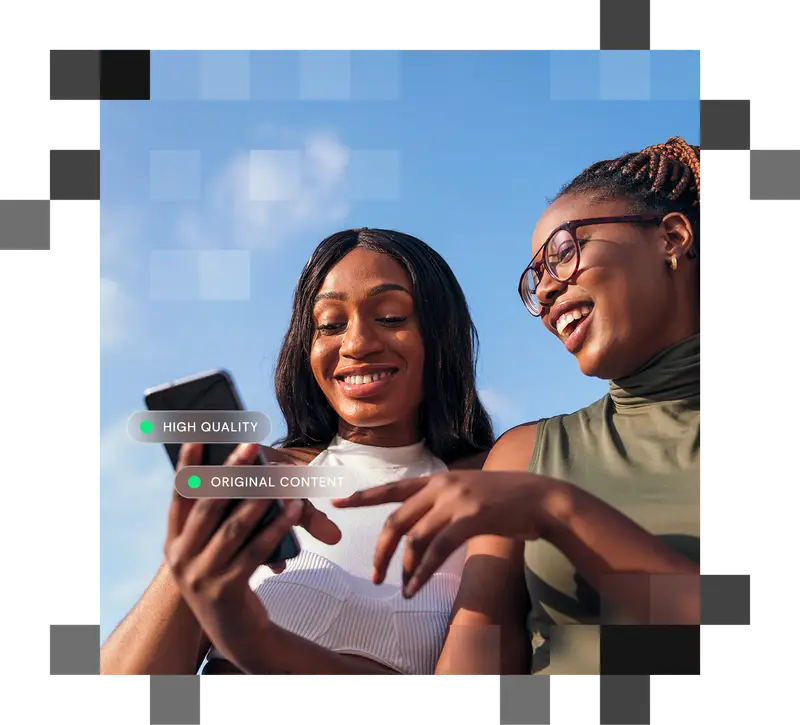 Girls sharing view of smartphone